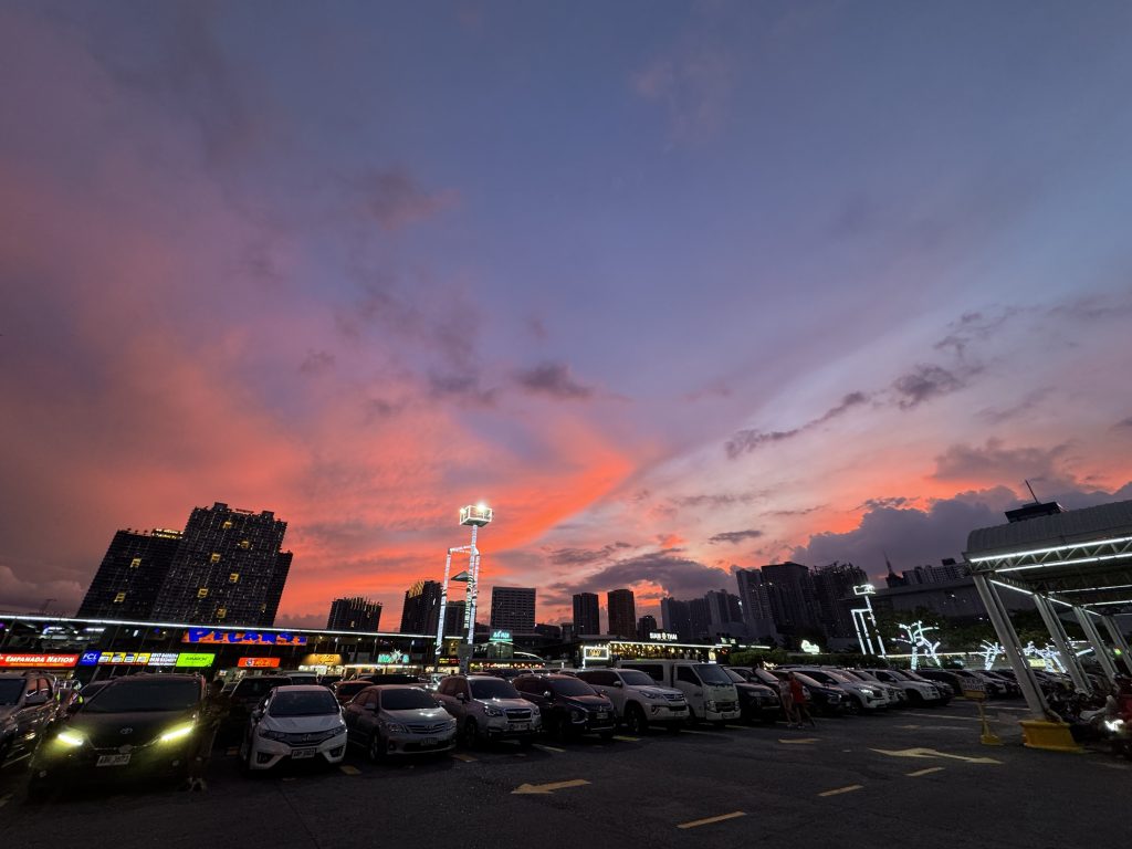 Stunning purple and orange sunset view at a parking lot in Pasig, Manila during magic hour